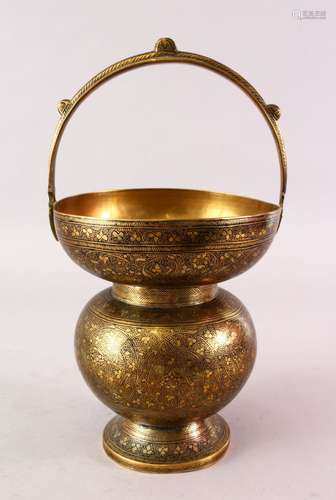 A GOOD INDIAN BRASS CHASED DECORATED SPITTOON, with scrolling floral design, 30cm high x 17cm wide.