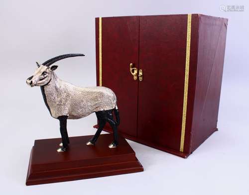 A RARE WHITE METAL QATARI FIGURE OF AN IBEX, standing on a plinth, complete with original box,