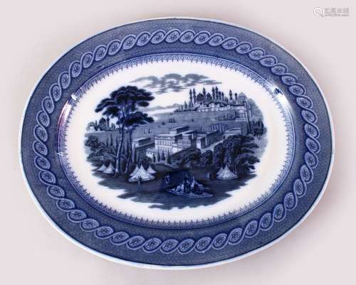 A LARGE ISTANBUL BLUE & WHITE PORCELAIN SEVING DISH OF A MOSQUE, the decoration of a mosque in a