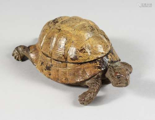 A COLD PAINTED BRONZE TORTOISE INKWELL, with a lift-up shell. 6ins long.