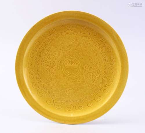 A GOOD CHINESE YELLOW GROUND INCISED PORCELAIN DRAGON SAUCER, the saucer incised with decoration