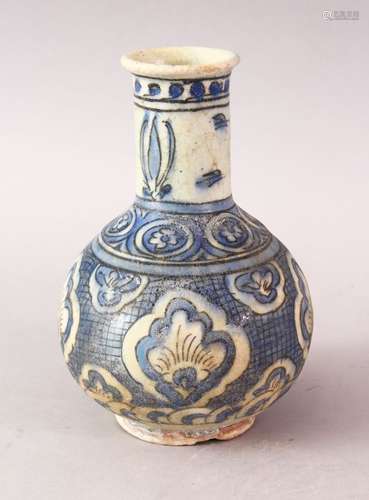 A GOOD ISLAMIC SAFAVID POTTERY VASE, with panels of stylized flora upon blue glaze, 18cm high.