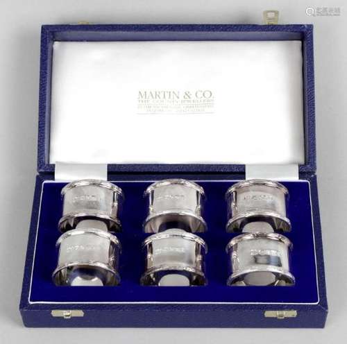 A cased set of six modern silver napkin rings,