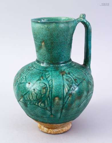 A GOOD EARLY ISLAMIC TURQUOISE GLAZED POTTERY JUG, 22cm high.