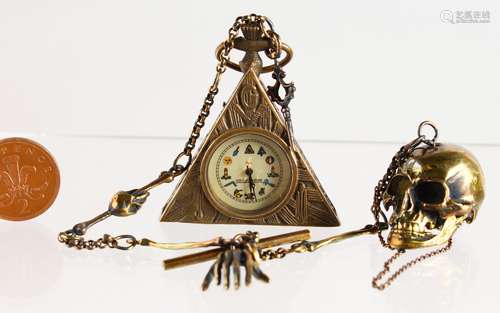 A BRASS NOVELTY SKULL WATCH and MASONIC WATCH and chain.