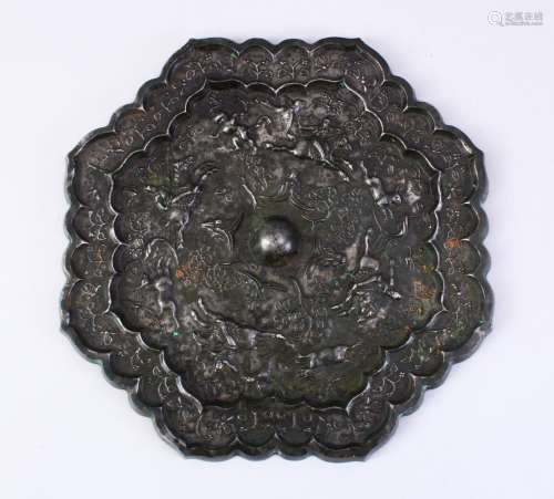 A LARGE 18TH CENTURY OR EARLIER CHINESE TANG STYLE BRONZE MIRROR, with decoration depicting