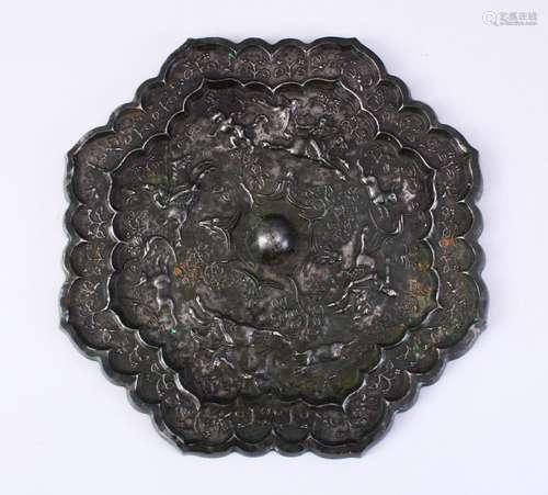 A LARGE 18TH CENTURY OR EARLIER CHINESE TANG STYLE BRONZE MIRROR, with decoration depicting