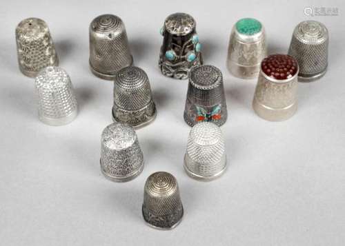 A selection of assorted hallmarked silver thimbles,