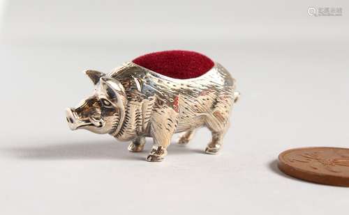 A CAST SILVER NOVELTY PIG PIN CUSHION.