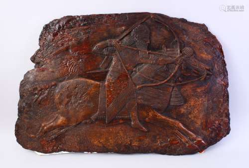 A LARGE INDIAN CARVED PLASTER PANEL OF A FIGURE UPON HORSE BACK, 57cm high x 90cm wide.