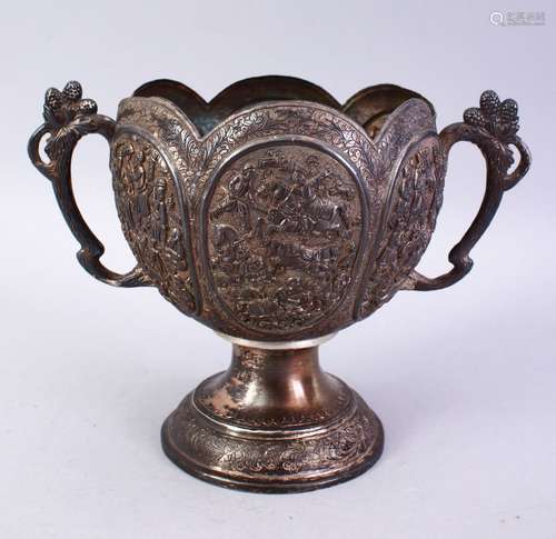 A GOOD ISLAMIC 19TH CENTURY MOULDED SILVER TWIN HANDLE JUG, The body of the jug with many panels