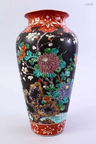 A 19TH CENTURY CHINESE FAMILLE NOIR PORCELAIN VASE, the body with a black ground with floral