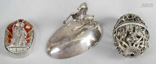 A pierced silver egg-shaped ornament,