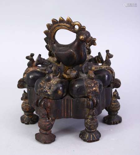 A 16TH / 17TH CENTURY ISLAMIC BRONZE SPICE HOLDER, with removable central bolt to allow opening