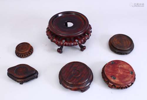 A GOOD MIXED LOT OF SIX 19TH CENTURY CHINESE CARVED HARDWOOD STANDS, one possibly hunghuali, various