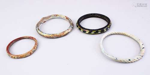 FOUR GOOD MAMLUK CARVED STONE / GLASS BRACELETS. largest 9cm.