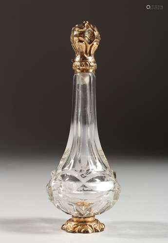 A CUT GLASS SCENT BOTTLE, with 18ct gold top and base. 4.5ins high.