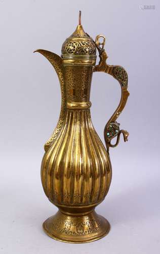 A GOOD BOKHARA SAFAVID BRASS EWER, with ribbed body, openwork cover, and turquoise inlaid handle,