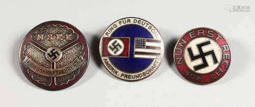 THREE SMALL REPRODUCTION GERMAN NAZI BADGES.