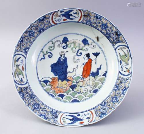 A CHINESE MING STYLE WUCAI PORCELAIN DISH, the dish decorated ith figures in a landscape, the base