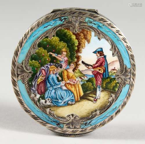 AN ENGRAVED SILVER AND ENAMEL DECORATED CIRCULAR COMPACT. 2.75ins diameter.