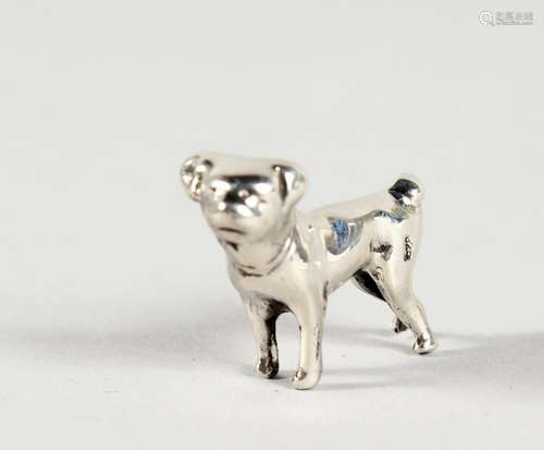 A MINIATURE SILVER DOG. 1ins long.