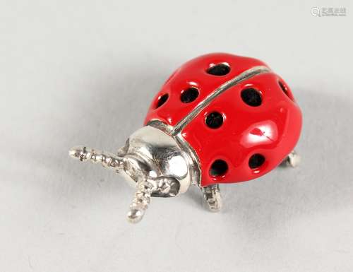 A MINIATURE SILVER AND ENAMEL LADYBIRD. 1ins long.