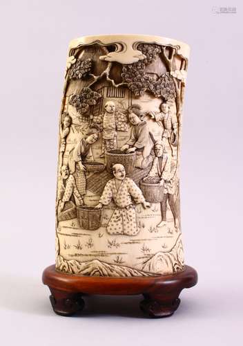 A GOOD JAPANESE MEIJI PERIOD CARVED IVORY TUSK VASE SECTION, the section carved in relief to