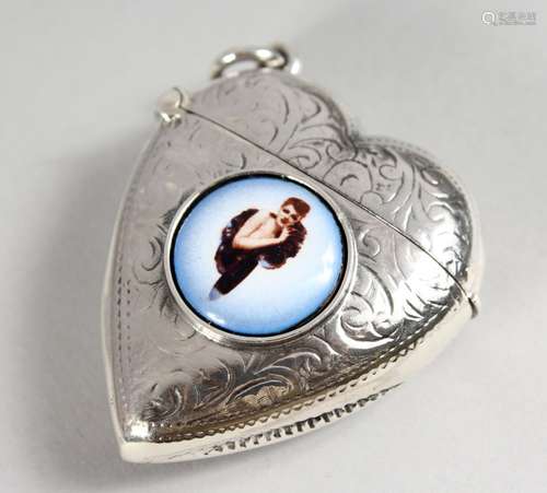 AN ENGRAVED SILVER HEART SHAPE VESTA CASE, with later enamel decoration.