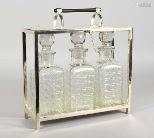 A GOOD CHRISTOPHER DRESSER DESIGN THREE BOTTLE TANTALUS.