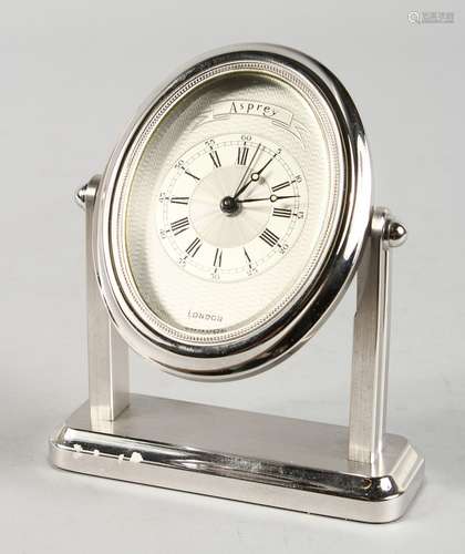 A VERY GOOD ASPREY OF LONDON OVAL STRUT TYPE CLOCK, with engine turned dial, Swiss made. 5.5ins