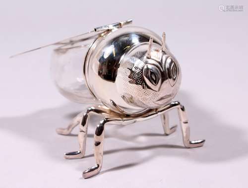 A SILVER PLATE AND GLASS HONEY BEE HONEY POT.