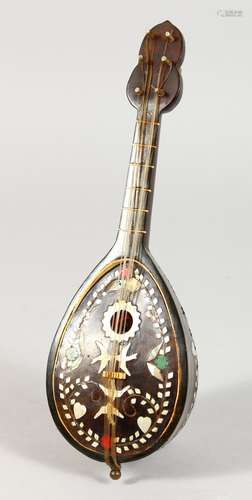 A MOTHER-OF-PEARL INLAID MUSICAL BOX, shaped as a mandolin. 9.5ins long.