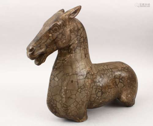 A GOOD POSSIBLY TANG DYNASTY CARVED POTTERY MODEL OF A HORSE BUST, with its head aloft and its mouth
