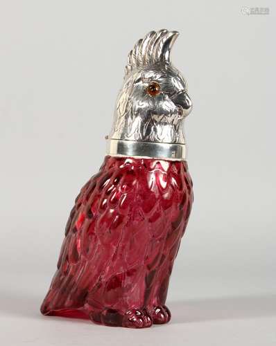 A CRANBERRY COLOUR GLASS AND PLATED PARROT FORM DECANTER. 10ins high.