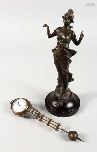 A MYSTERY CLOCK, modelled as a lady. 11ins high.