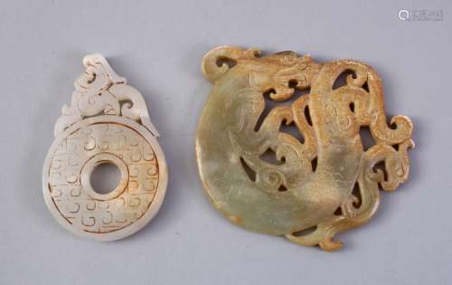TWO CHINESE CARVED JADE PENDANTS, one of a bi - disk 7cm, the other of a dragon, 8cm