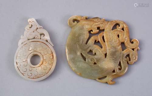 TWO CHINESE CARVED JADE PENDANTS, one of a bi - disk 7cm, the other of a dragon, 8cm