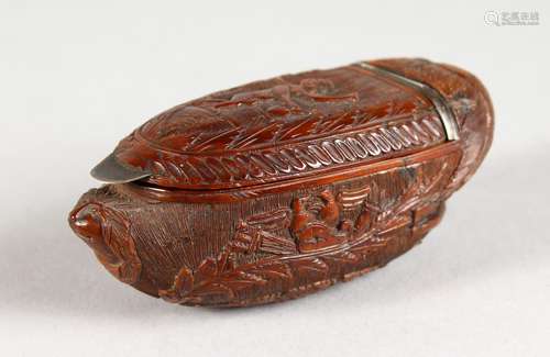 A GOOD CARVED COQUILLA NUT SNUFF BOX. 3ins long.