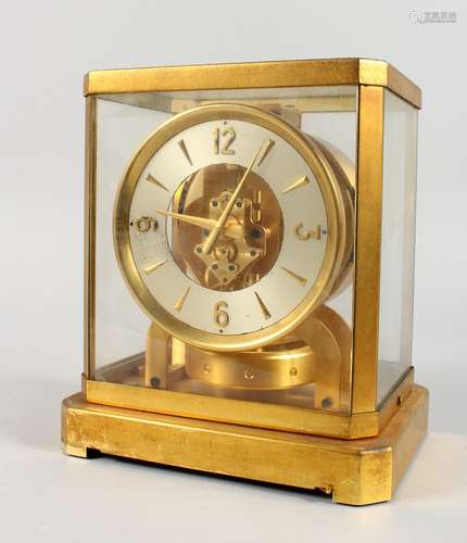 A JAEGER-LECOULTRE ATMOS CLOCK, with silvered dial. 9ins high.