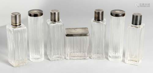 SEVEN SILVER TOP SCENT BOTTLES.