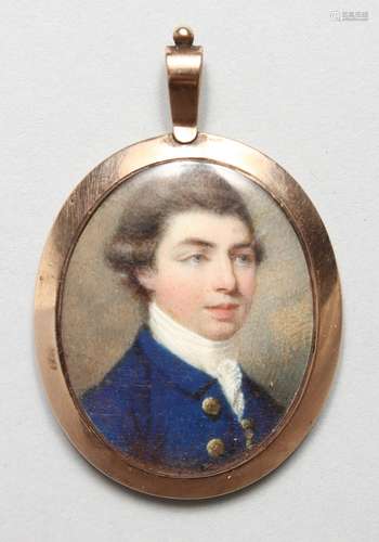 A GEORGIAN OVAL PORTRAIT MINIATURE OF A GENTLEMAN, blue coat and white shirt, the reverse of the