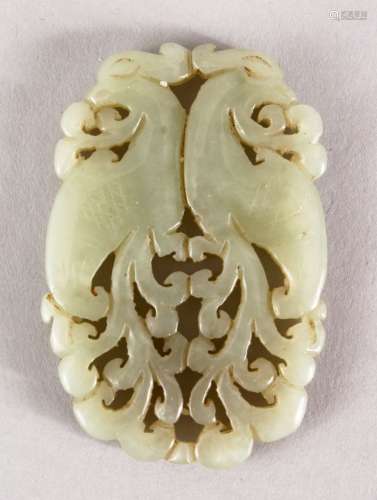A GOOD 19TH / 20TH CENTURY CHINESE CARVED CELADON JADE PENDANT OF TWO PEACOCKS, two opposing