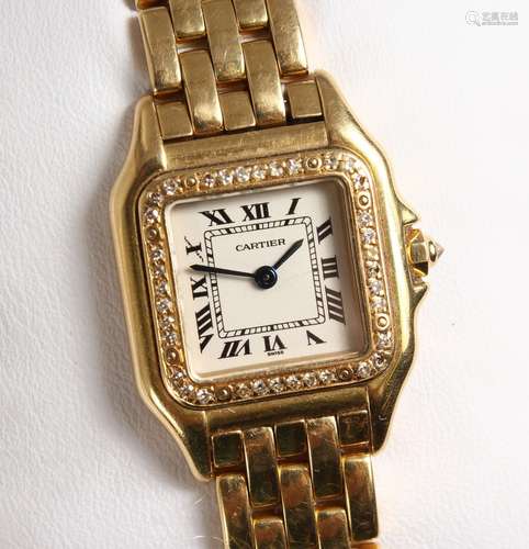 A VERY GOOD 18CT YELLOW GOLD CARTIER WRISTWATCH, the face surrounded by small diamonds, No.