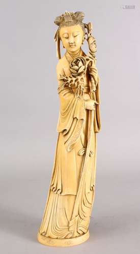 A GOOD 19TH CENTURY CHINESE CARVED IVORY FIGURE OF GUANYIN, stood holding her staff and floral