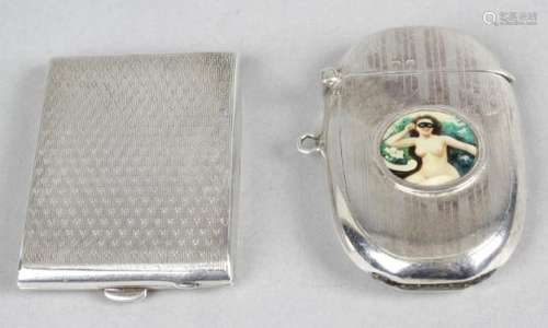 A silver matchbook case,