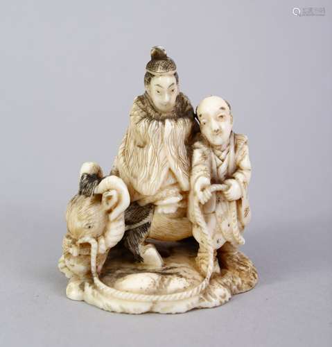 A JAPANESE MEIJI PERIOD CARVED IVORY OKIMONO OF OXEN & ATTENDANT, one figure upon the back of the