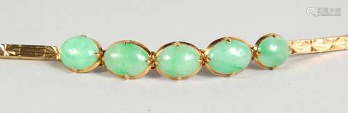 AN 18CT GOLD FIVE-STONE JADE BRACELET, in a green pouch.