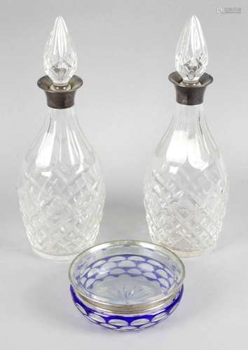 A pair of cut glass decanters and stoppers,