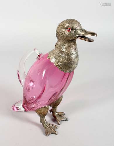 A VERY GOOD DUCK CLARET JUG, with glass body, plated head with glass eyes and plated feet. 10.5ins